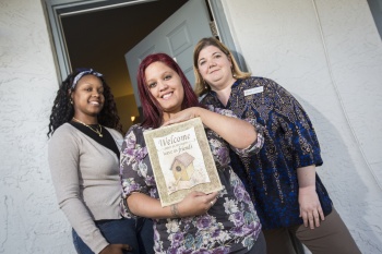 3 Women holding their Initiative Certificate