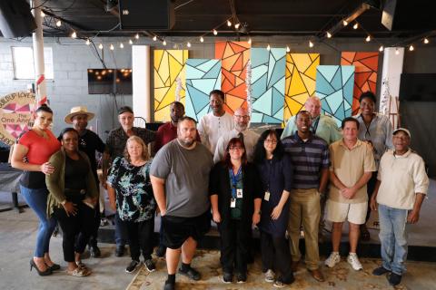 Guests of honor and staff at move-in celebration