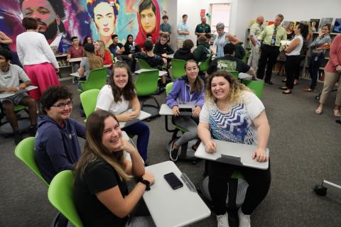 Students smile excitedly in their new learning space