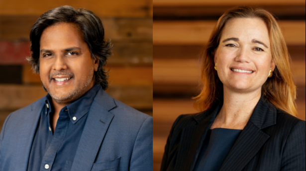 a man in a blue jacket smiles against a wood wall and a woman in a black jacket smiles against a woo wall