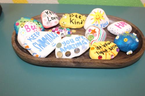 Colorful rocks with kind messages on them.