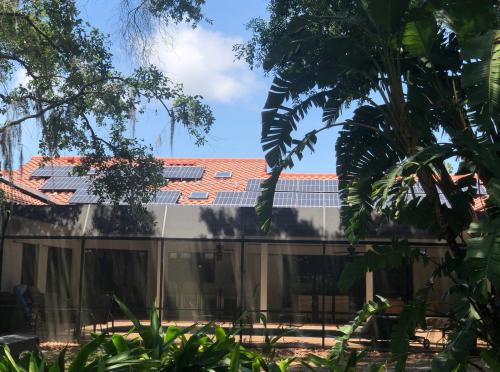 Image of home with solar panels on roof.