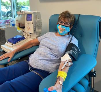 woman giving blood donation