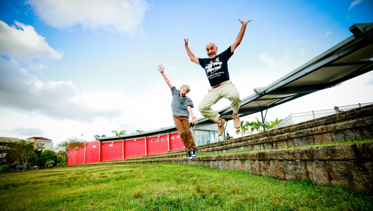 Grandfather and Grandson jumping in celebration