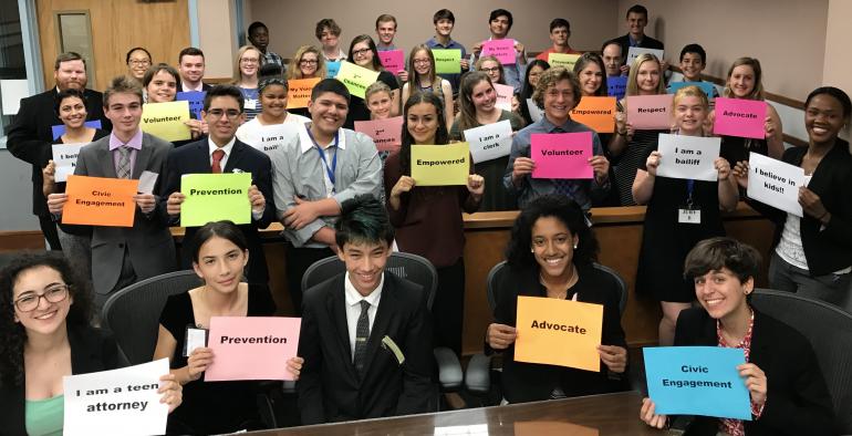 Teen Court Holding Signs