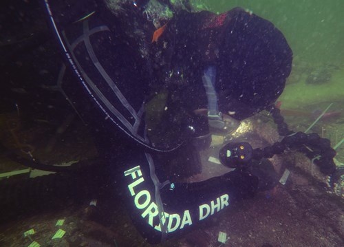 An archaeologist from the Division of Historical Resources investigate the site. Manasota Key Offshore site investigation